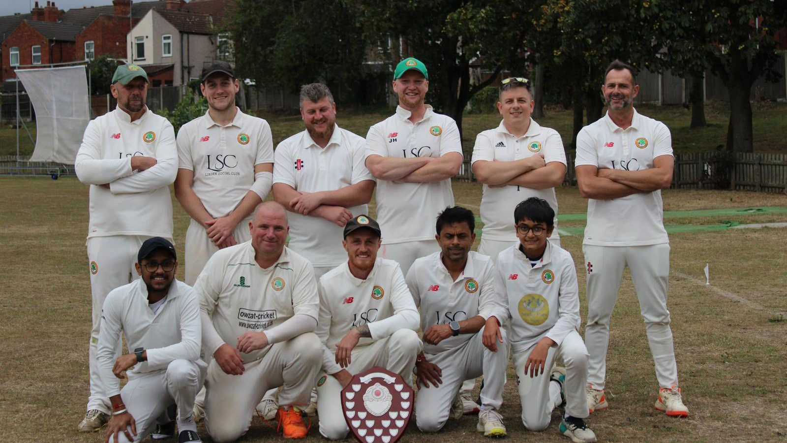 Second XI Team celebrating on the field after securing champions
